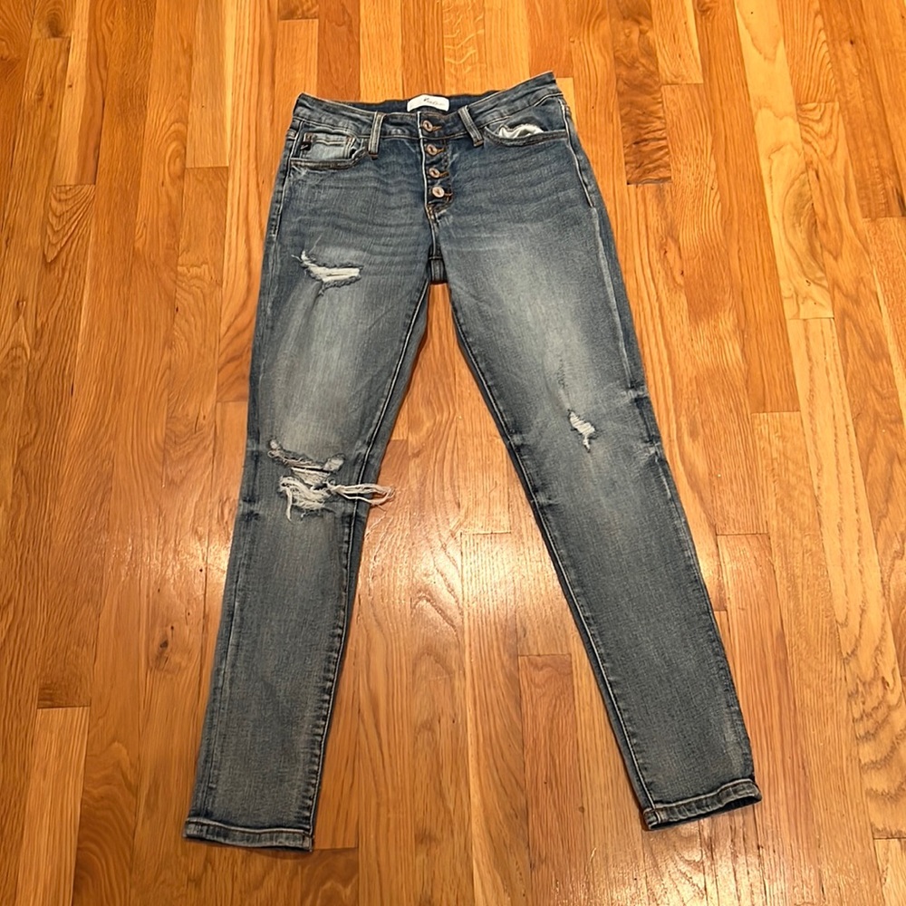 Button fly mid rise ripped jeans